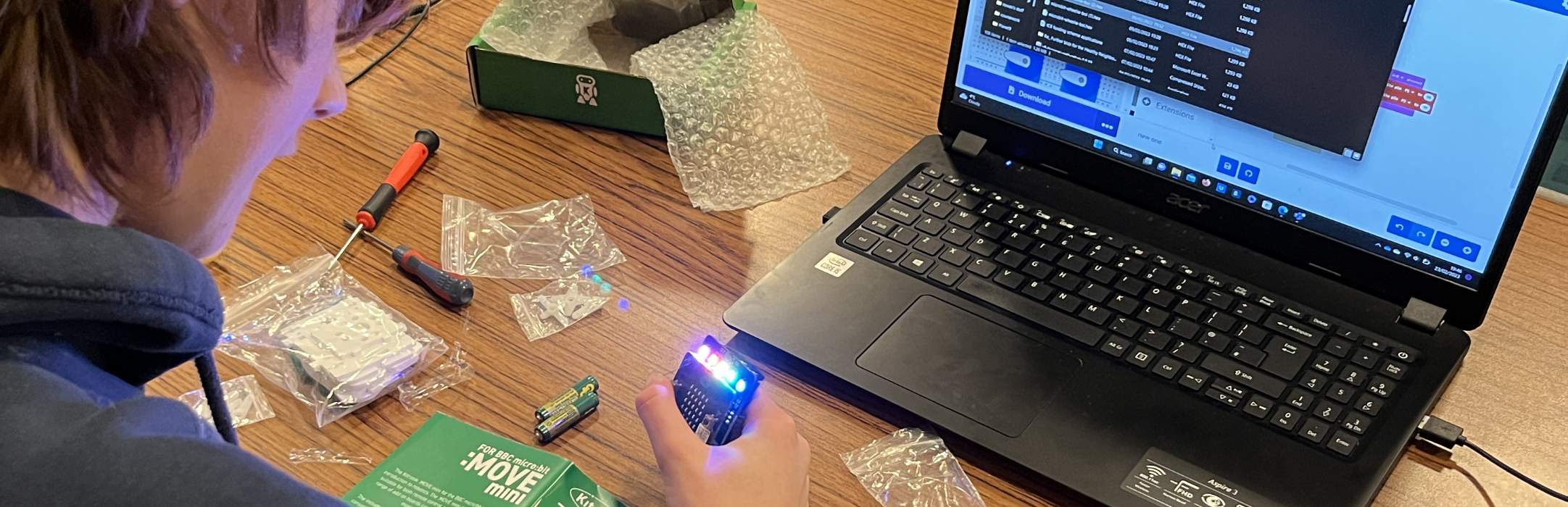 Quantum Code Club members learning to build robots