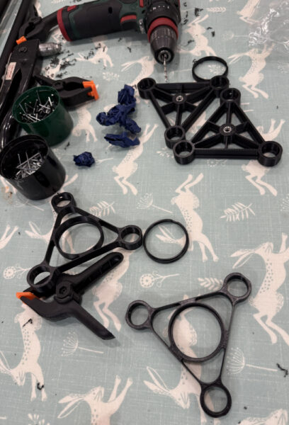 Collection of Qyramid beam components awaiting assembly